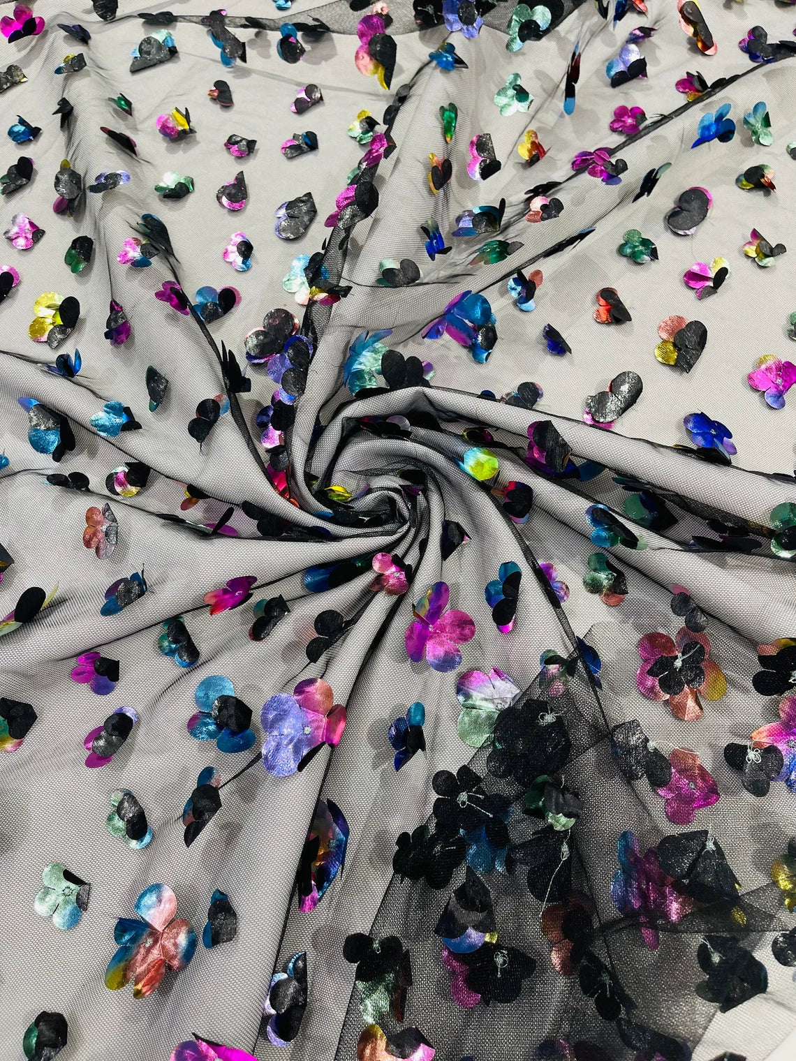 3D Holographic Rainbow Fabric - 3D Rainbow Foil Flowers on Solid Black Mesh Sold By Yard