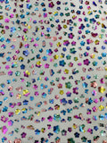 3D Holographic Rainbow Fabric - 3D Rainbow Foil Flowers on Solid White Mesh Sold By Yard