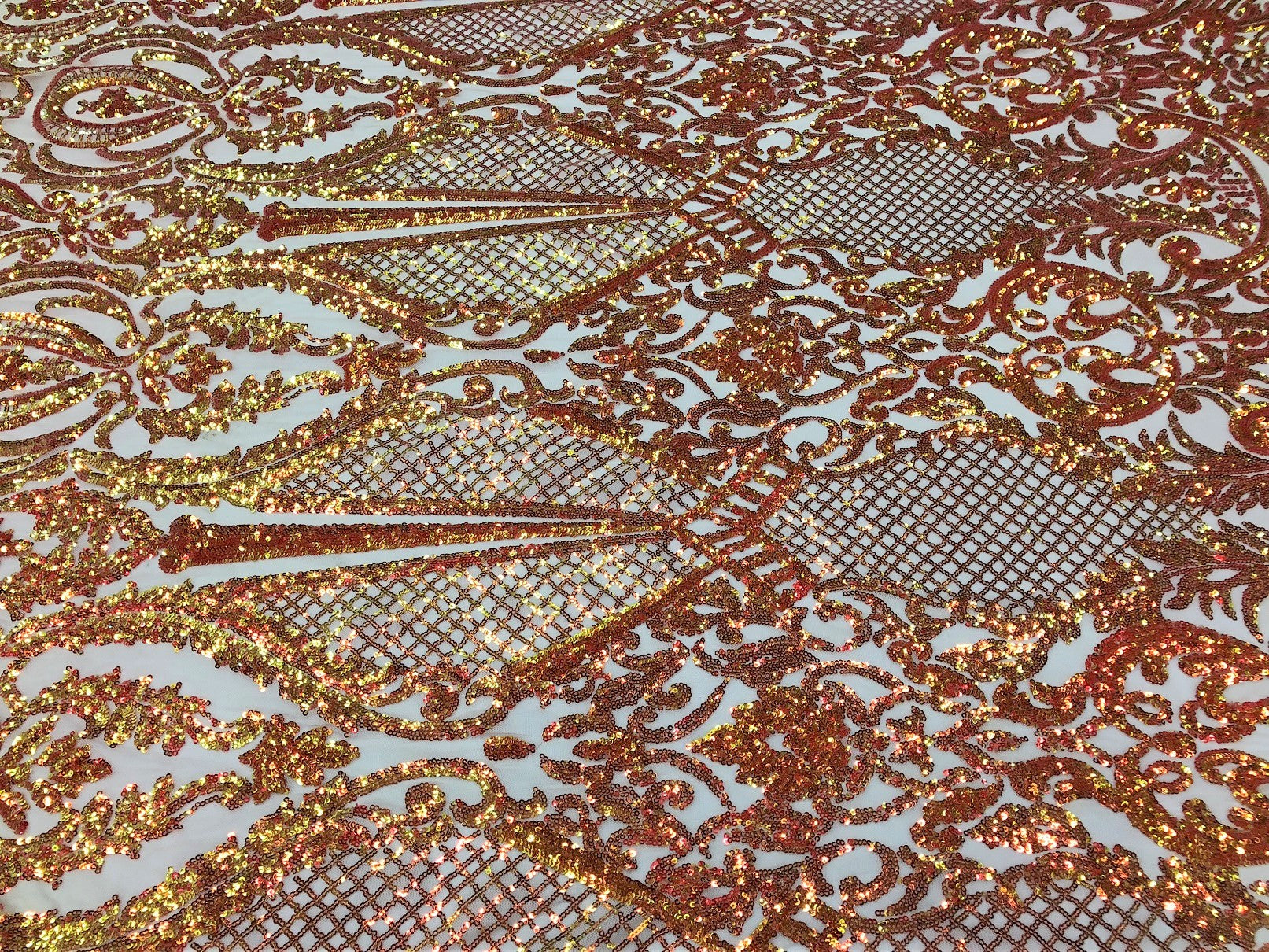 Iridescent Orange Sequin, 4 Way Stretch Damask Design Fabric On Blush Stretch Mesh By The Yard