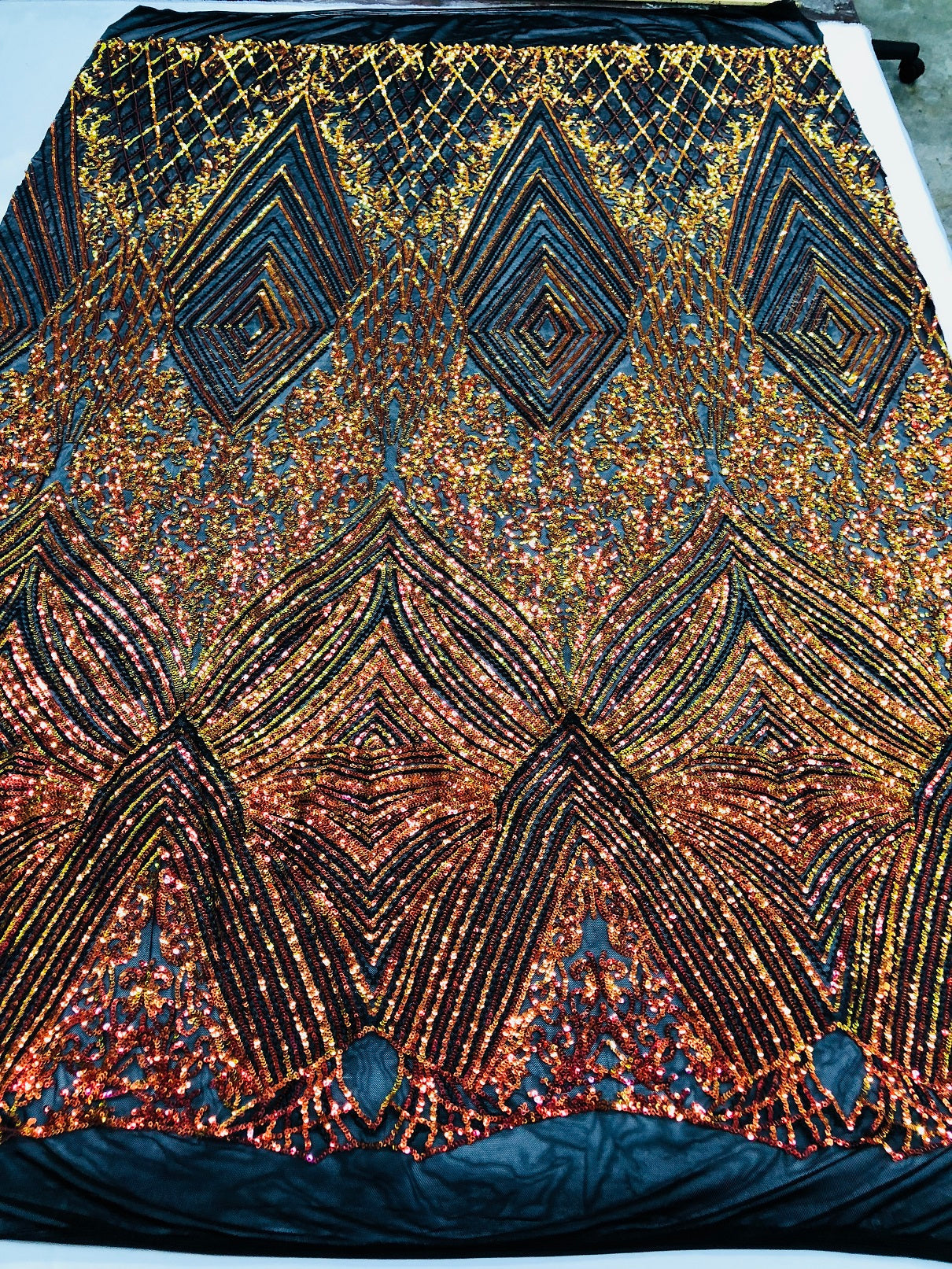 Iridescent Orange - 4 Way Stretch Sequins Pattern Fabric on Black Mesh Sold By The Yard