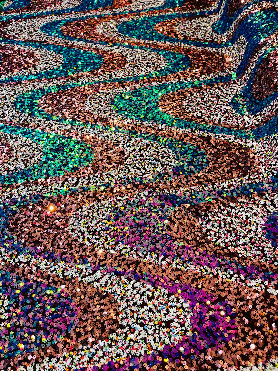 Multi-Color Wavy Sequins - Multi-Color Green/Orange/Pink/White - Sequins Design on Black Mesh Fabric Sold By Yard