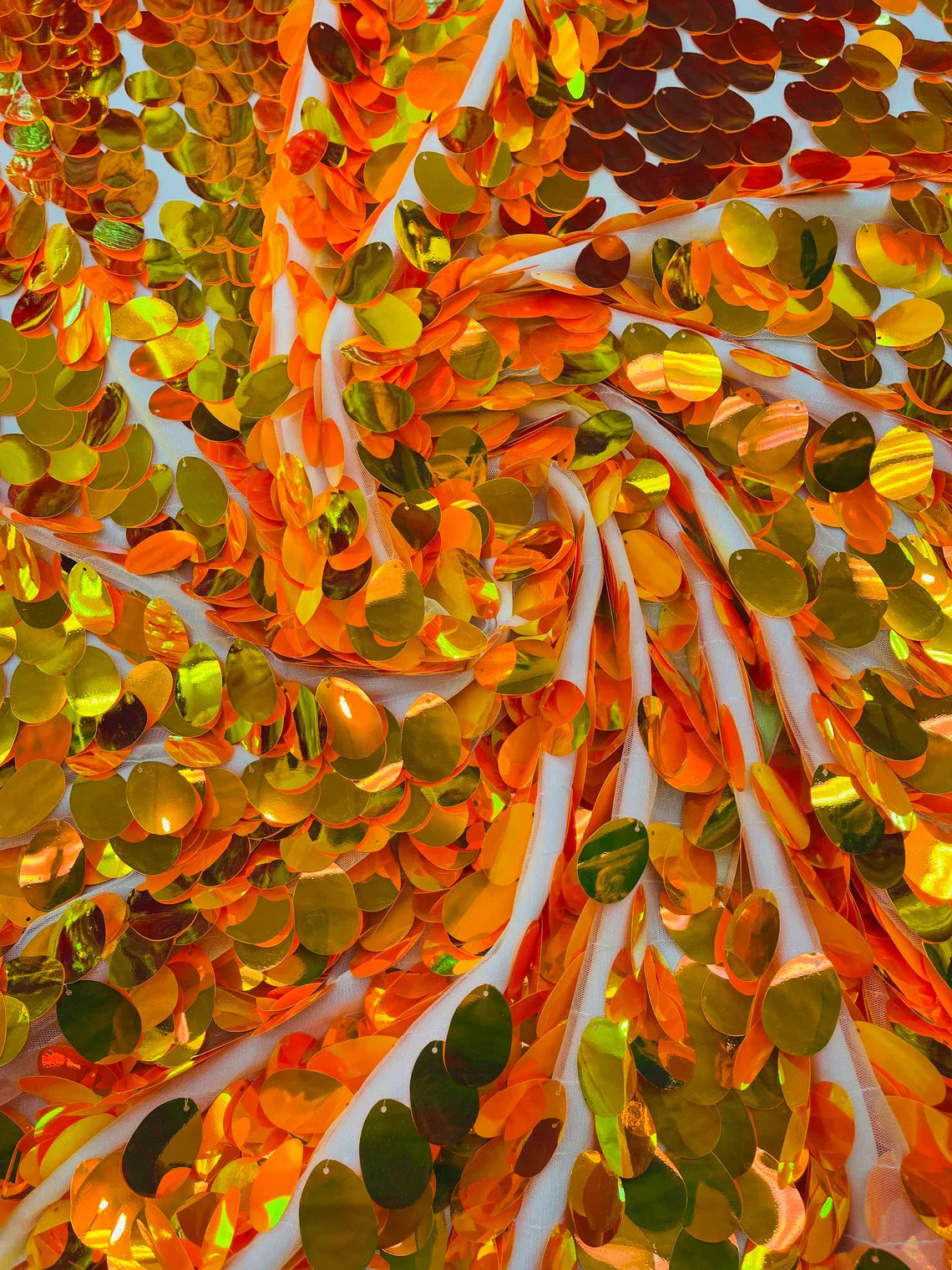 Iridescent Jumbo Oval Sequins - Orange Iridescent - Paillette Oval Sequins Fabric on White Mesh Sold By Yard
