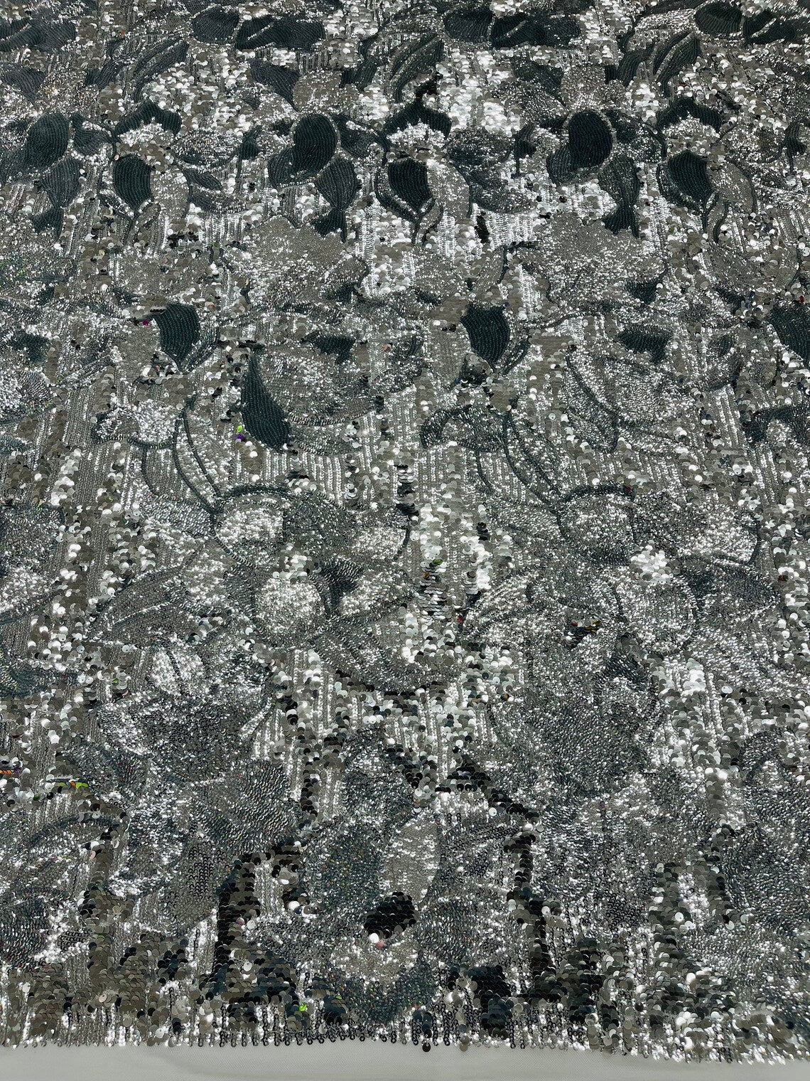 Orchid Design Sequins - Silver on White - 4 Way Stretch Full Sequins Floral Design Mesh Fabric By Yard