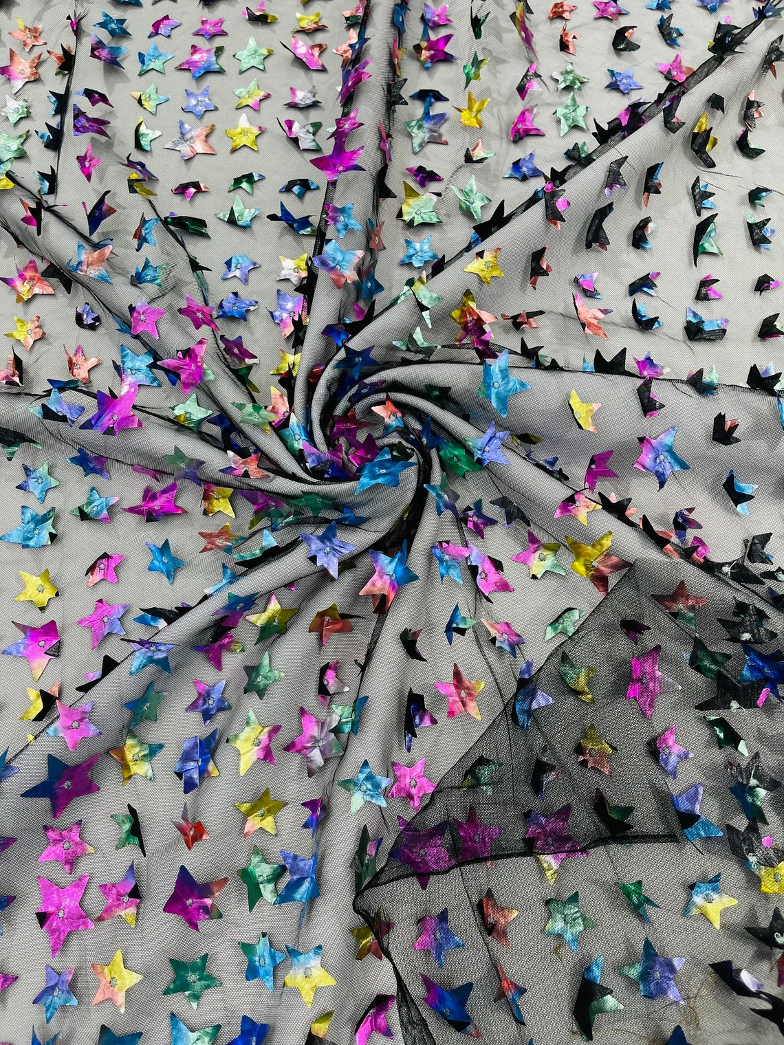 3D Holographic Rainbow Fabric - 3D Rainbow Foil Stars on Solid Black Mesh Sold By Yard