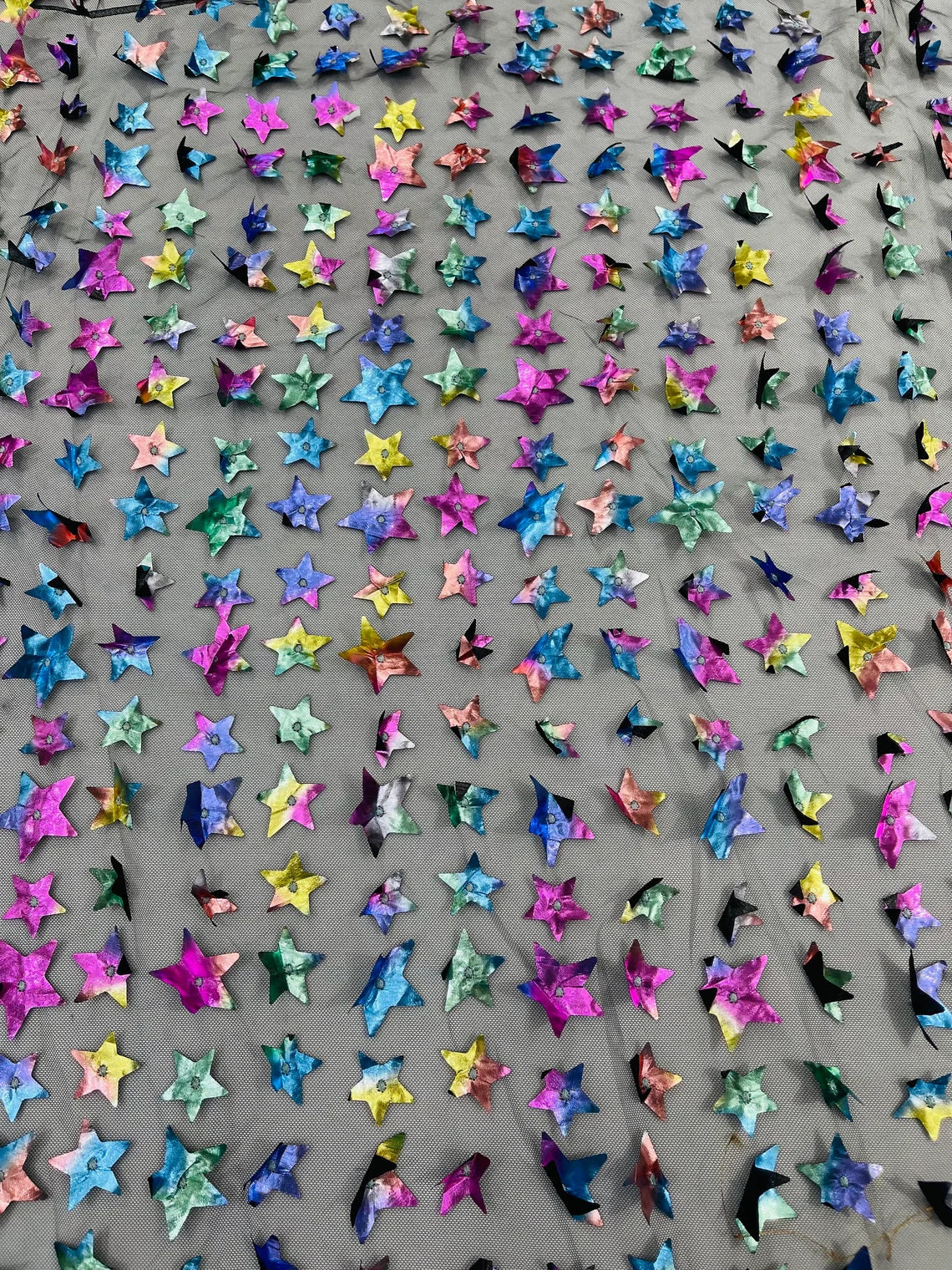 3D Holographic Rainbow Fabric - 3D Rainbow Foil Stars on Solid Black Mesh Sold By Yard