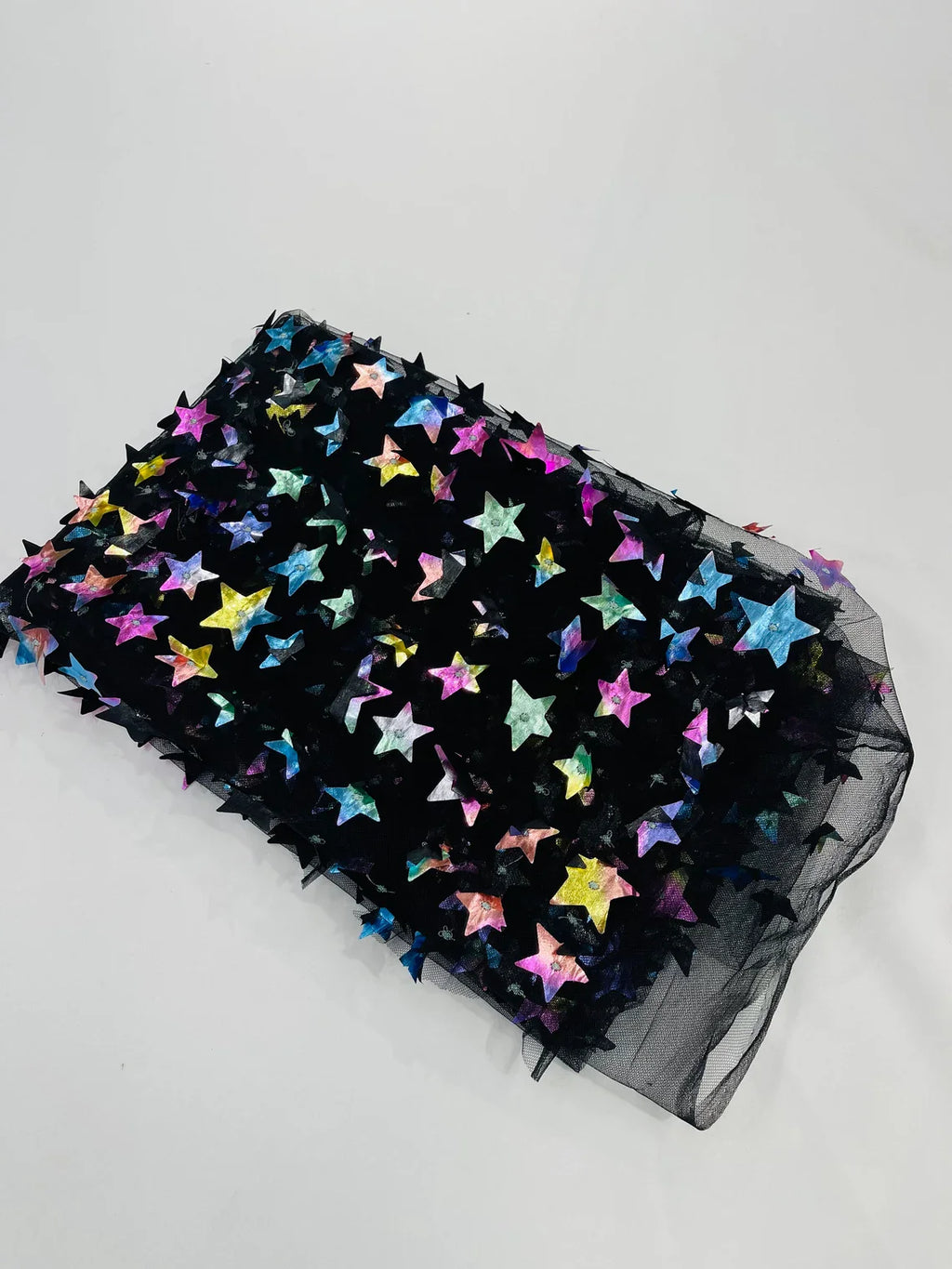 3D Holographic Rainbow Fabric - 3D Rainbow Foil Stars on Solid Black Mesh Sold By Yard