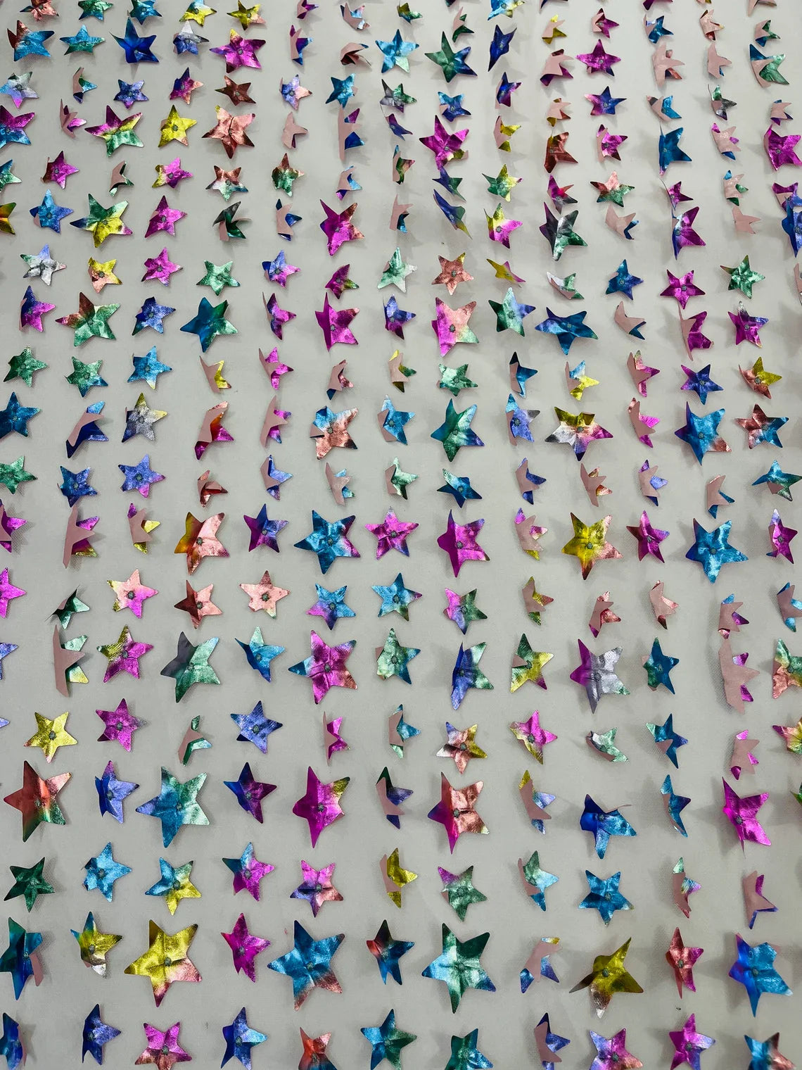 3D Holographic Rainbow Fabric - 3D Rainbow Foil Stars on Solid White Mesh Sold By Yard