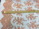 Metatron fabrics Majestic bridal wedding flower mesh super beaded lace peach. Sold by the yard