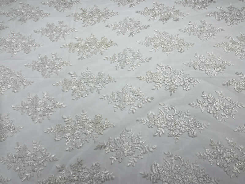 White Floral Lace Fabric - by the yard - Corded Flower Embroidery Design With Sequins on a Mesh